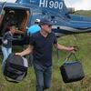 Blair Hedges getting off a helicopter for a science expedition in Haiti